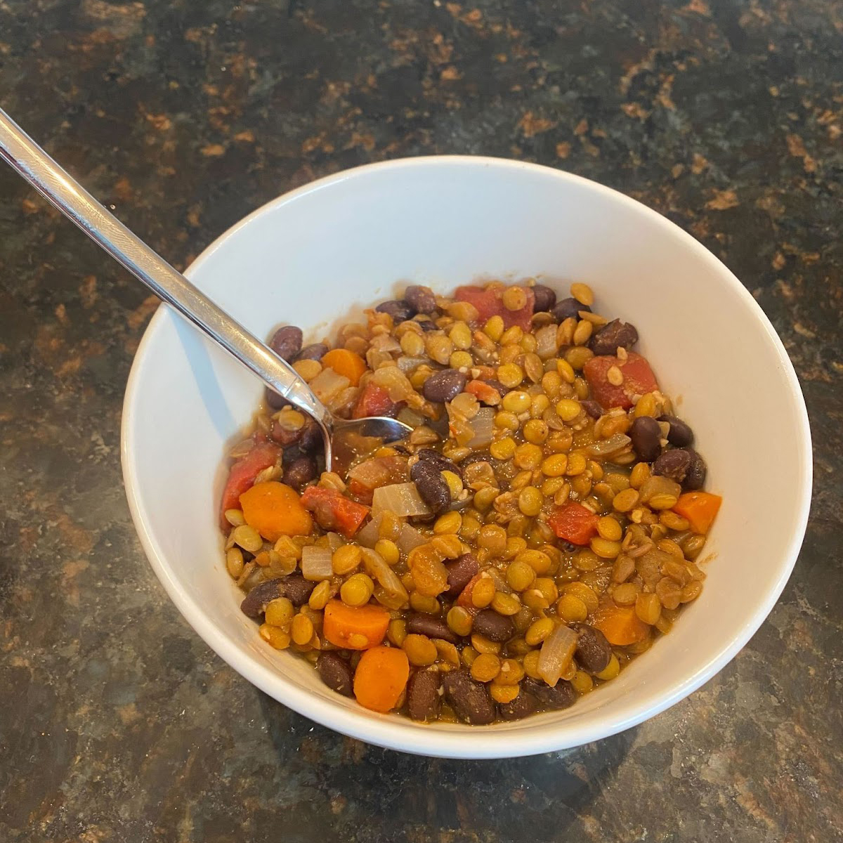 Prepared bowl of Protein Packed Black Bean and Lentil Soup, a heart-healthy recipe prepared by Jen from Advantia Health.